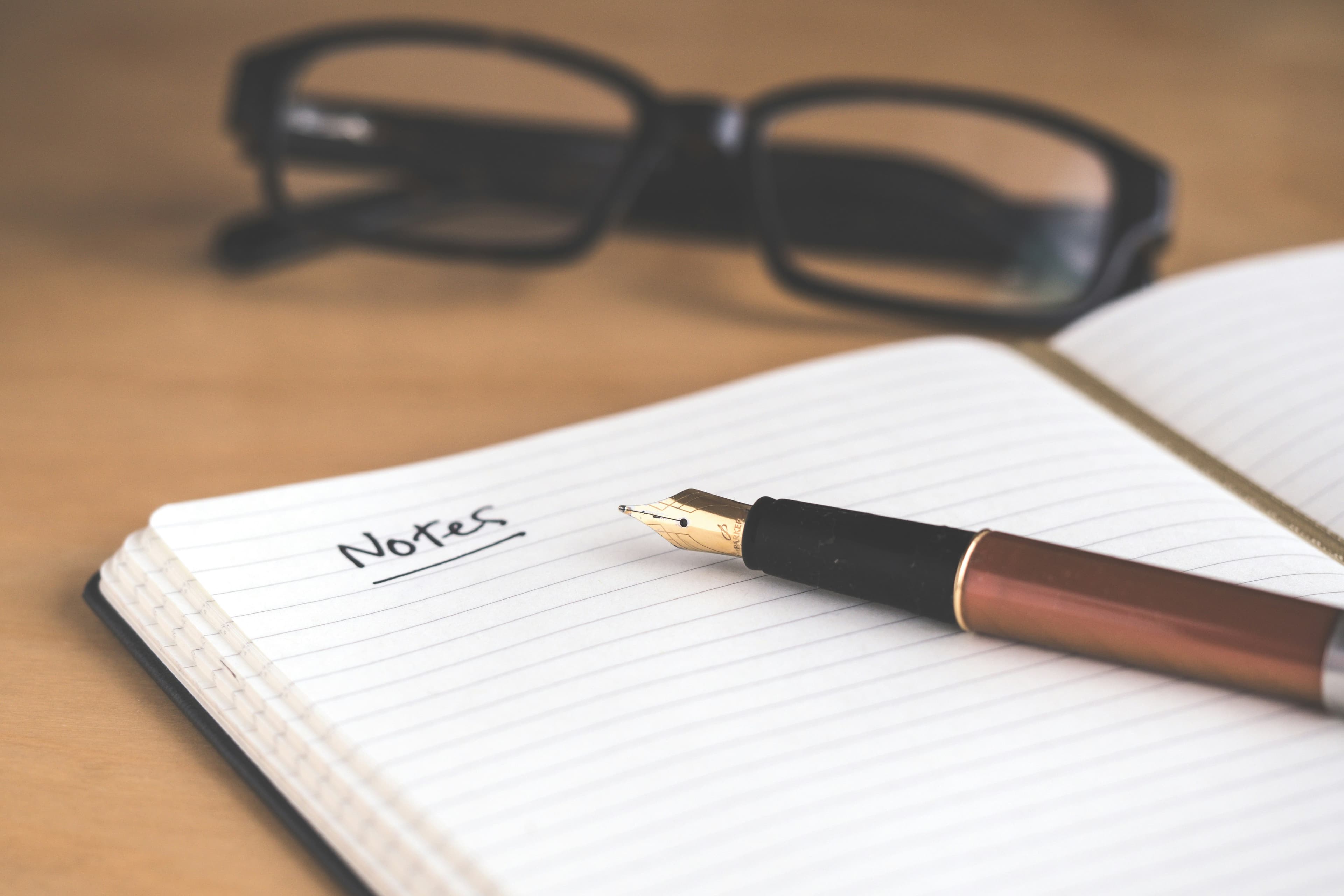 Notebook and pen on a desk